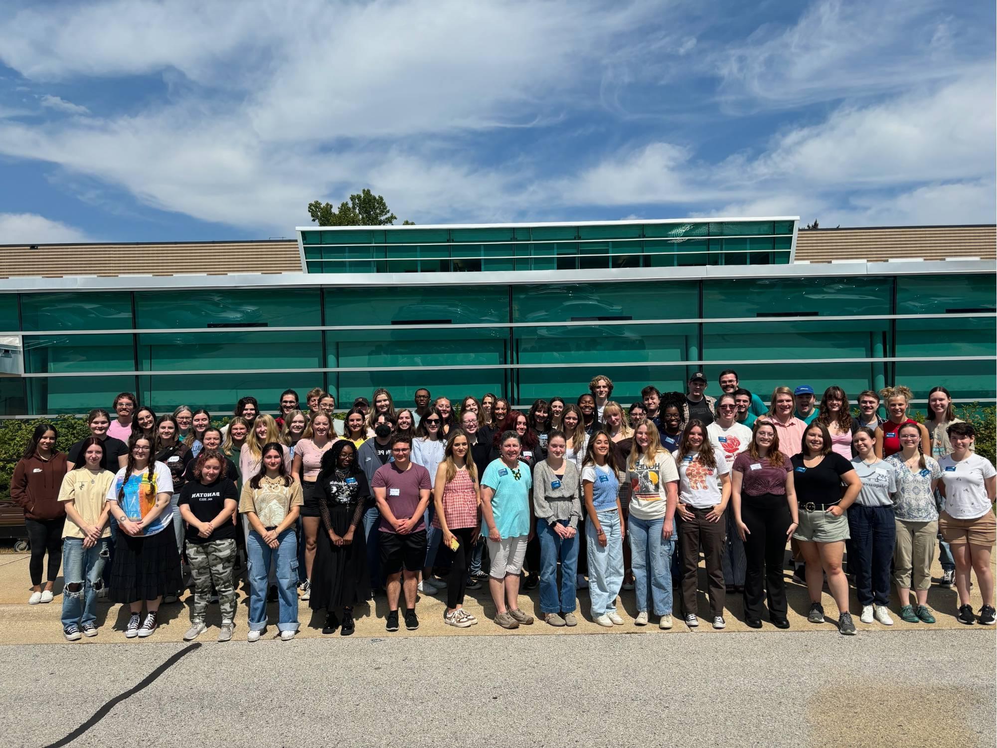 2024 Writing Consultant staff in front of Lake Ontario Hall